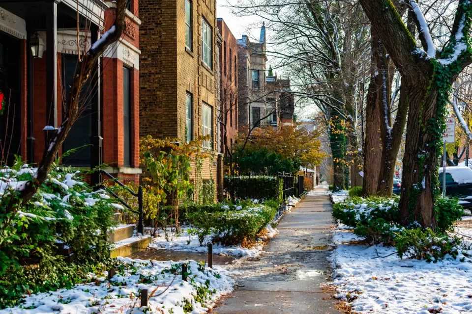 Chicago sidewalk with brick homes in winter.